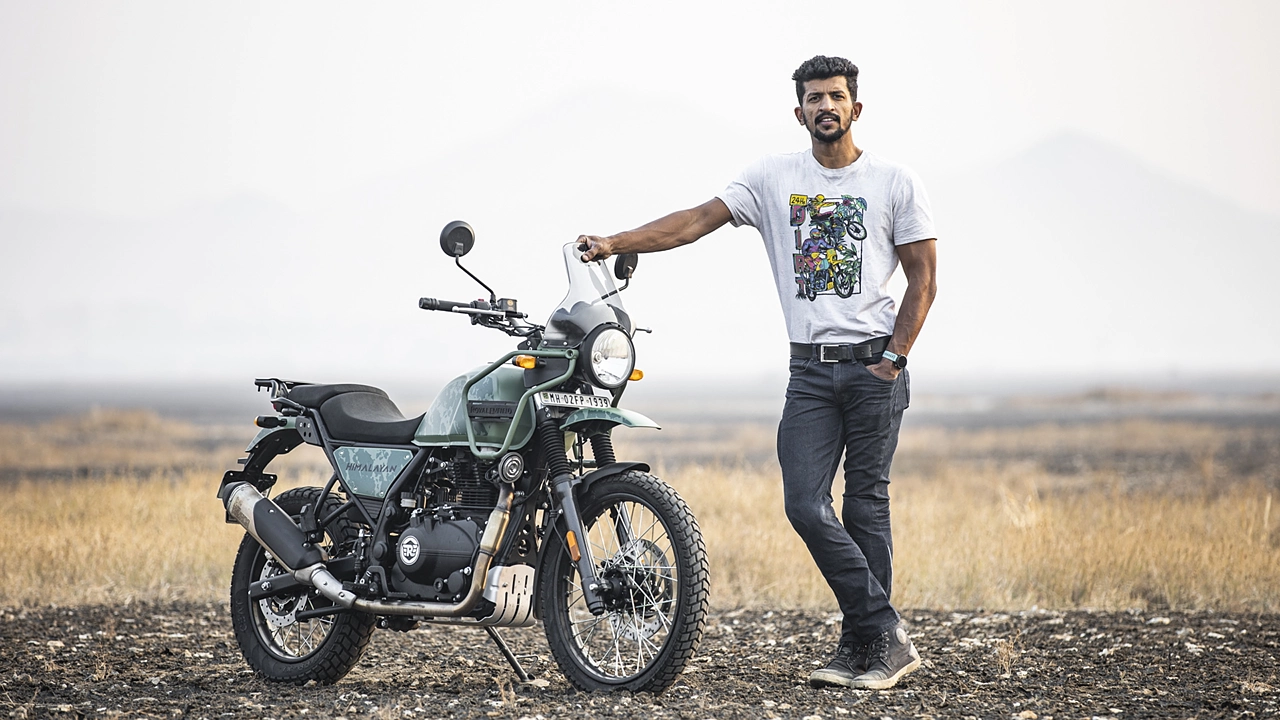 Photo of a Man Posing Between Two Motorcycles · Free Stock Photo